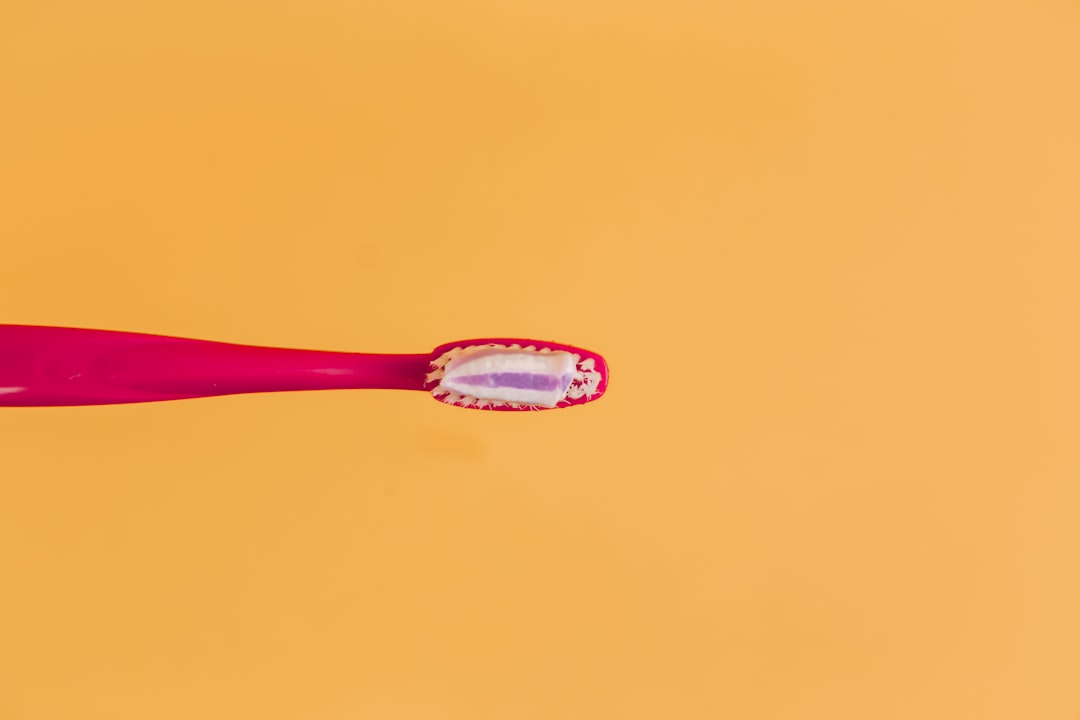 Toothbrush and oral care tools on a bathroom counter